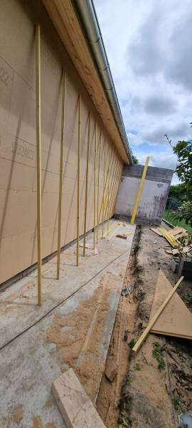 Isolation de mur a ossature bois par l'extérieur en panneaux rigide de fibre de bois isolair a ALBI par les 2 charpentiers. 